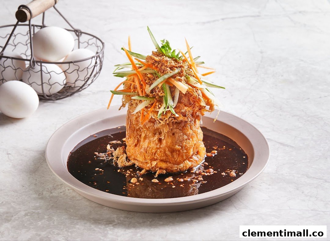 A beautifully presented fried egg dish with rich sauce and fresh julienned vegetables, alongside a basket of eggs.