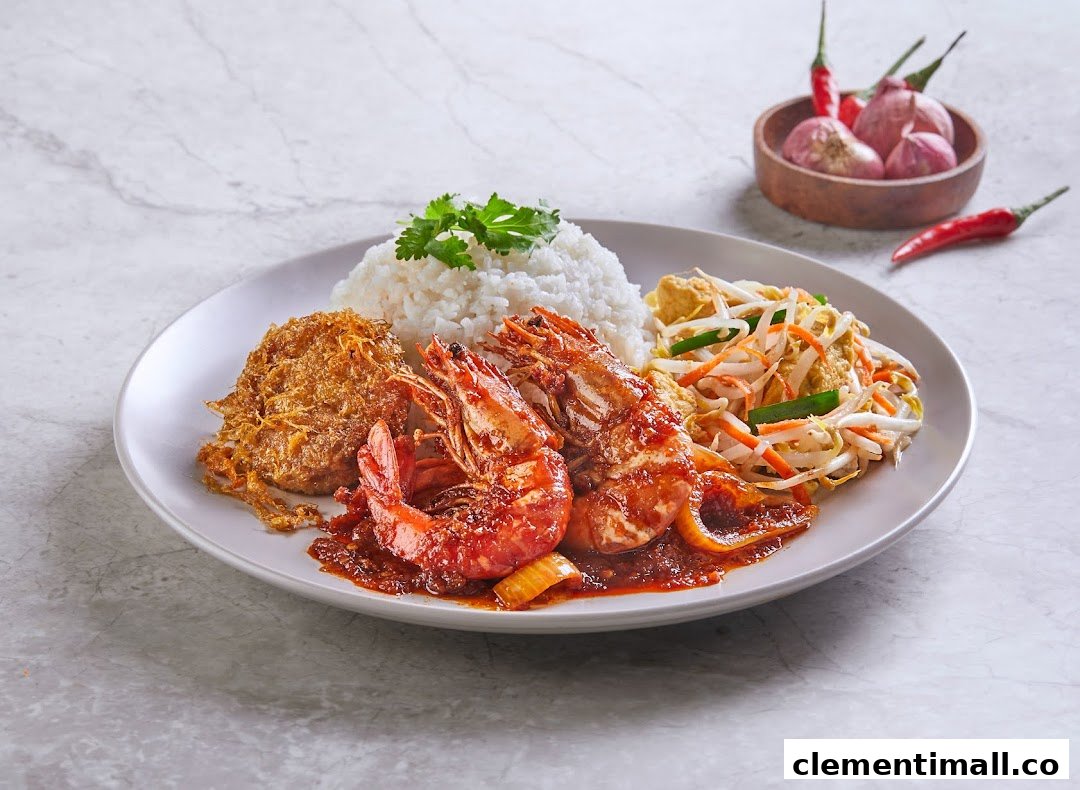 A vibrant plate featuring rice, sambal prawns, a crispy omelet, and stir-fried bean sprouts.
