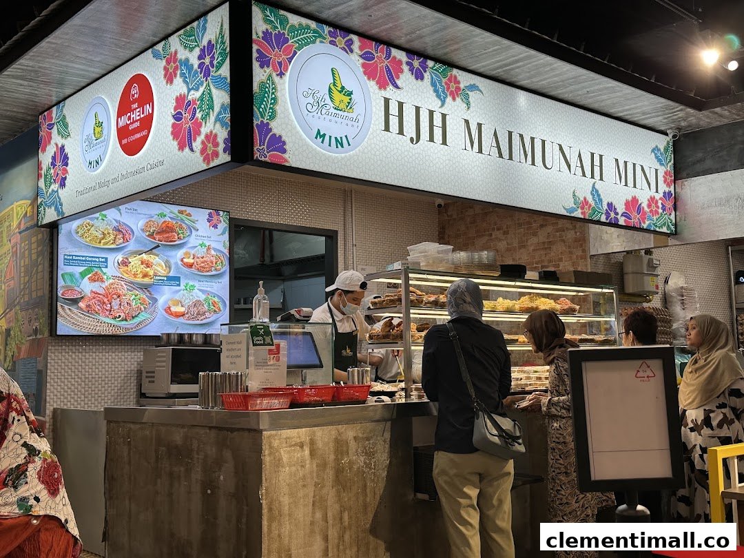 Customers at Hjh Maimunah Mini food stall, featuring a digital menu and traditional Malay/Indonesian cuisine.
