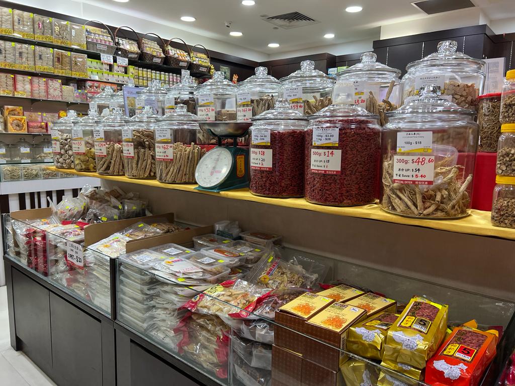 Interior view of Hockhua Tonic, showcasing traditional Chinese herbs and tonics in glass jars and packaged goods.