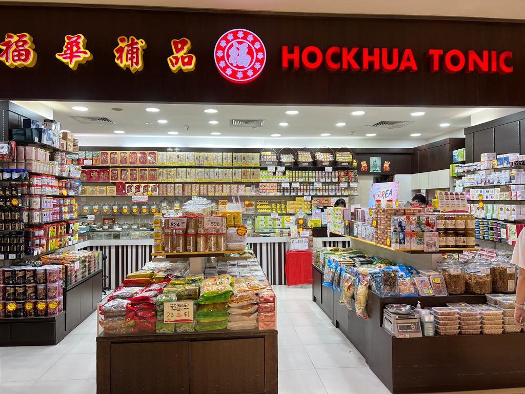 The interior of Hockhua Tonic, showcasing shelves filled with traditional Chinese health products and tonics.