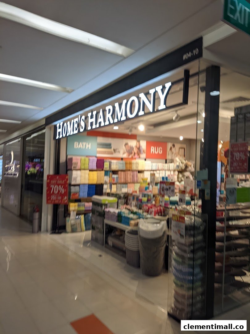 The brightly lit storefront of Home's Harmony, showcasing home essentials and textiles.