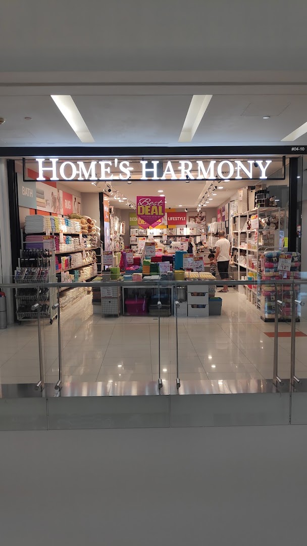 The storefront of Homes Harmony, showcasing a wide array of home goods and textiles.