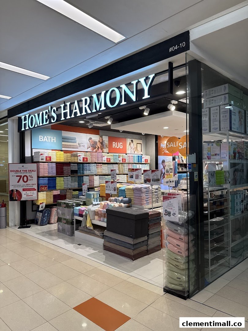 The storefront of Home's Harmony, showcasing home textiles, bath, and rug products.