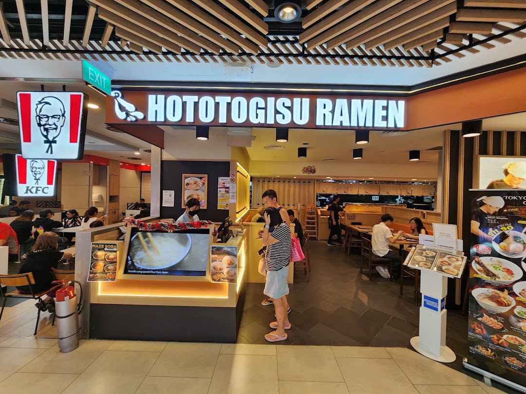 The image captures the inviting entrance and bustling interior of Hototogisu Ramen, with customers dining.