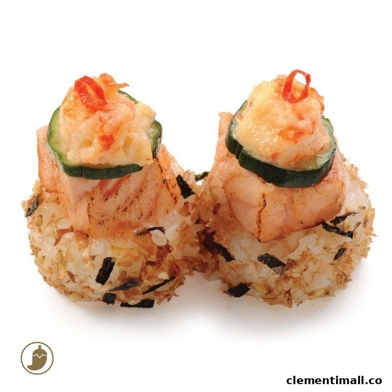 Two pieces of Japanese rice balls topped with grilled salmon, cucumber, and creamy seafood.