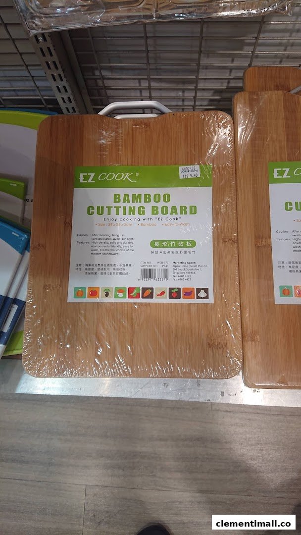 A close-up of an EZ Cook bamboo cutting board with product information and pricing on a shelf.