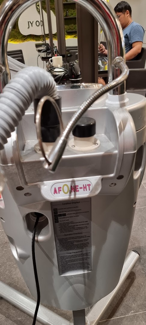A close-up of professional hair salon equipment with a reflection of the modern interior.
