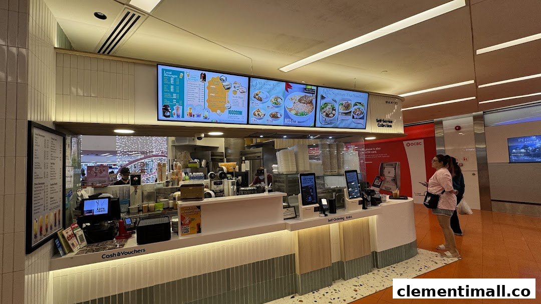 Interior view of Kaffe Toast Thai Noodle Bar's service counter with prominent digital menu boards.
