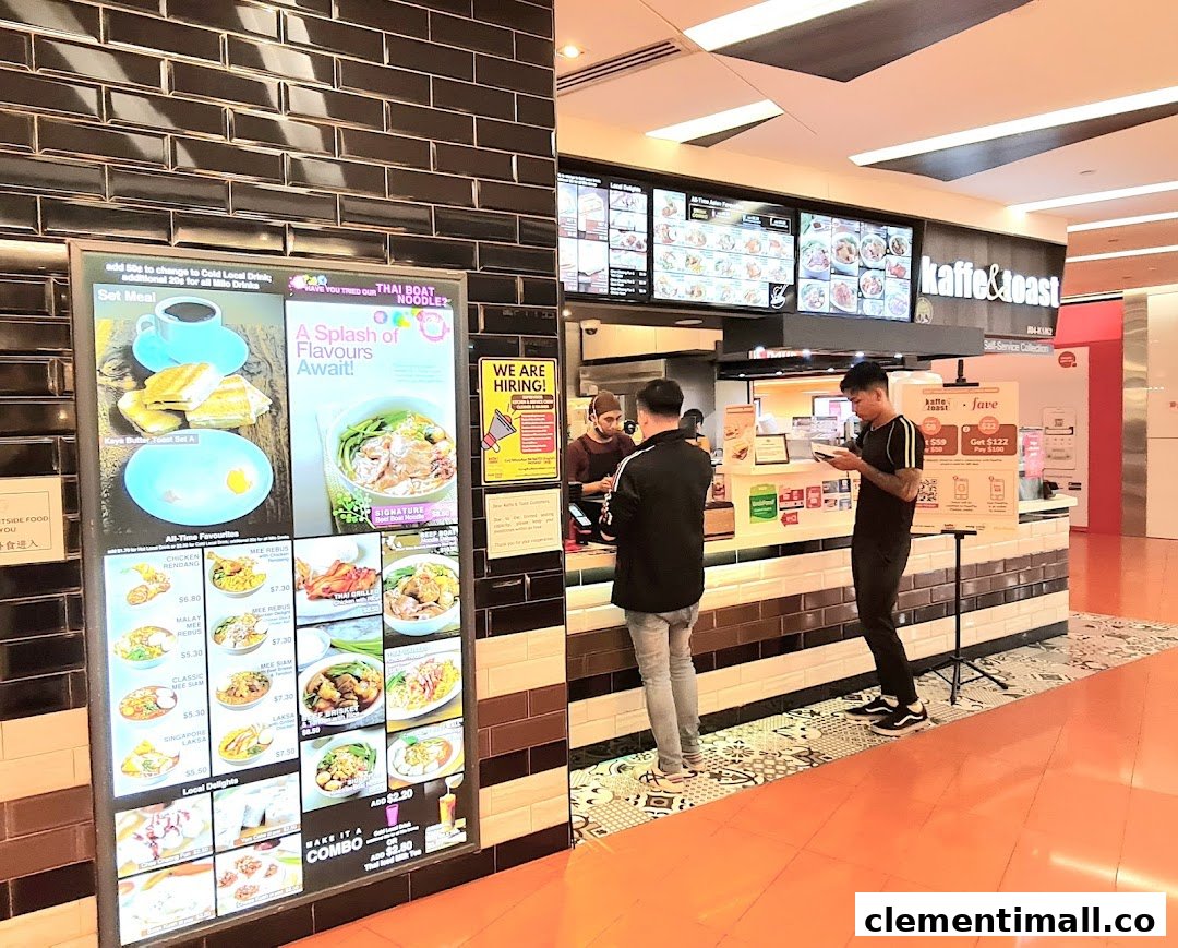 Customers at Kaffe & Toast ordering from a digital menu display featuring various local dishes and drinks.
