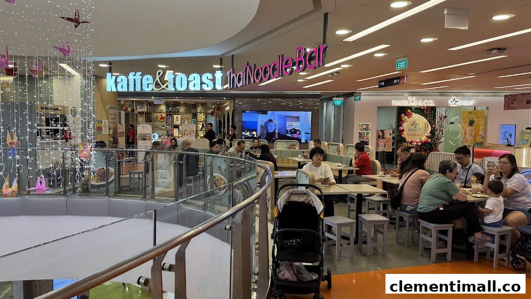 A bustling view of Kaffe & Toast Thai Noodle Bar within a shopping mall, with customers dining.