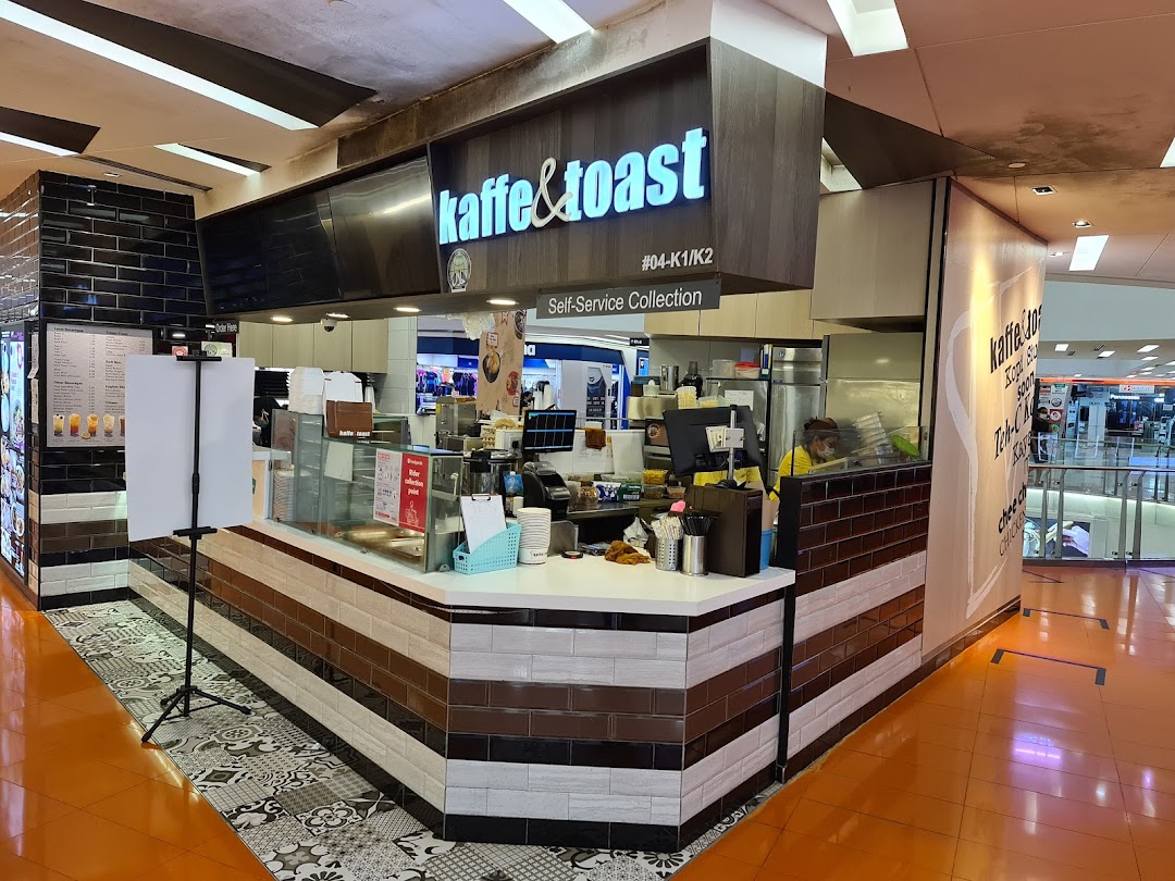 The front counter and signage of Kaffe & Toast, a self-service collection point in a mall.