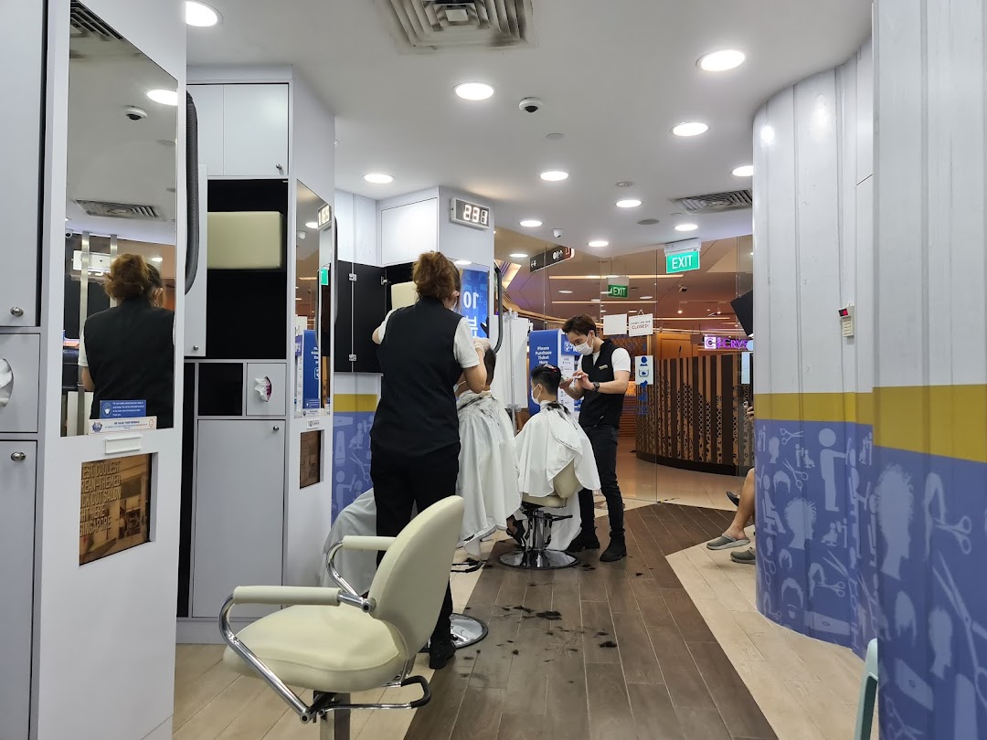 Inside kcuts Clementi Mall, stylists are busy providing quick and efficient haircuts to customers.