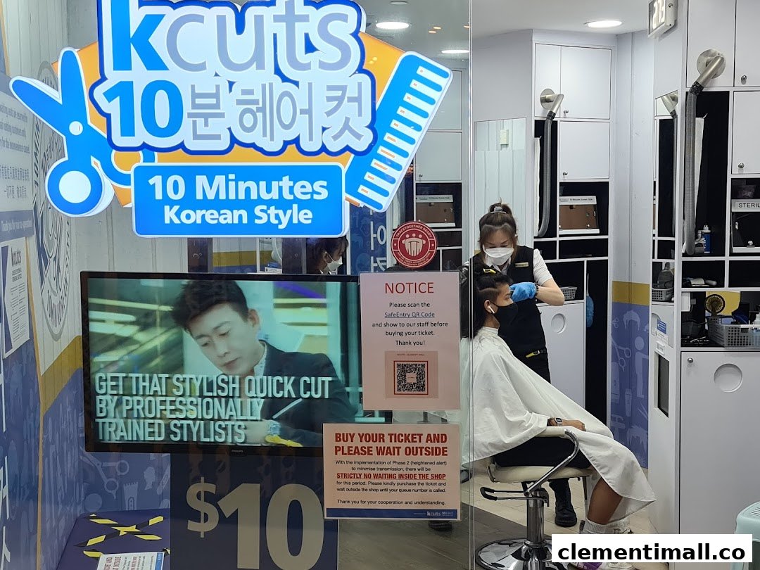 The shopfront of kcuts, a hair salon, featuring its '10 Minutes Korean Style' service and a customer receiving a haircut.