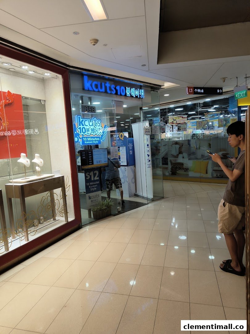 The storefront of kcuts 10-minute Korean style haircut salon at Clementi Mall, featuring its entrance and signage.