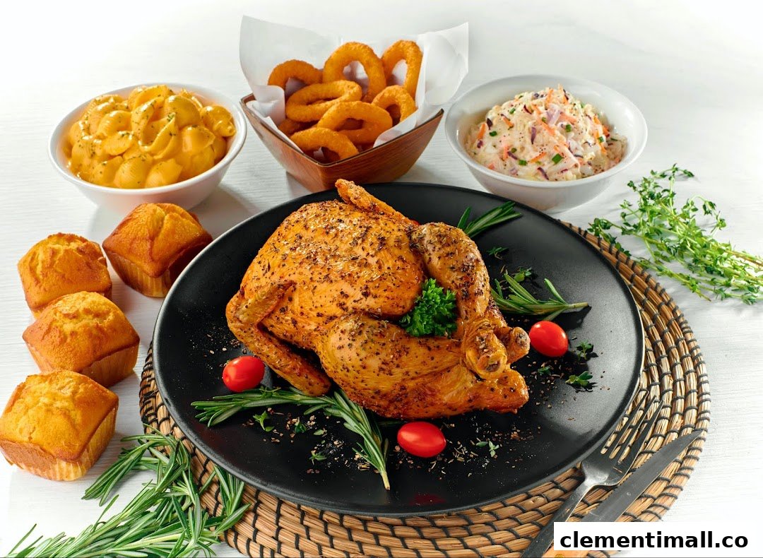 A perfectly roasted chicken with mac and cheese, onion rings, coleslaw, and corn muffins.