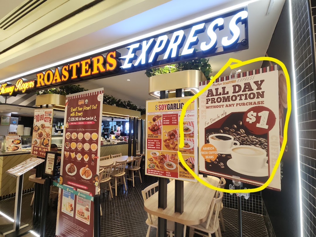 The brightly lit entrance of Kenny Rogers Roasters Express features promotional banners and inviting seating.