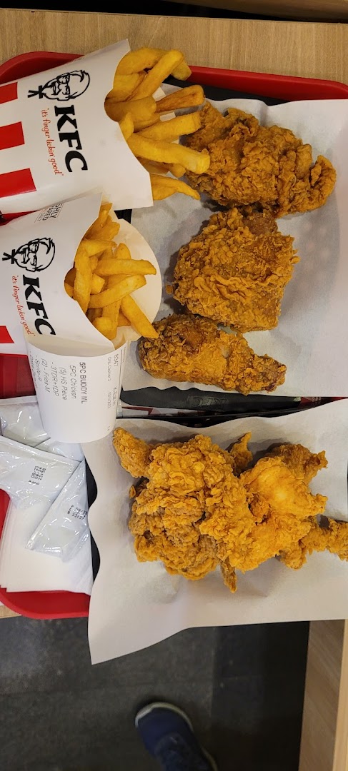 A tray of crispy fried chicken and golden fries from KFC.