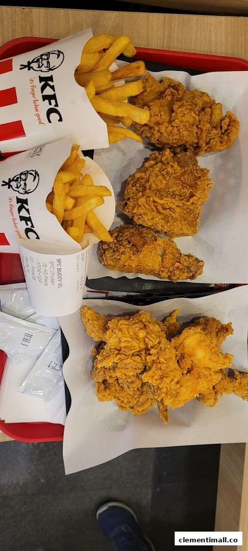 A tray of crispy fried chicken and golden fries from KFC.