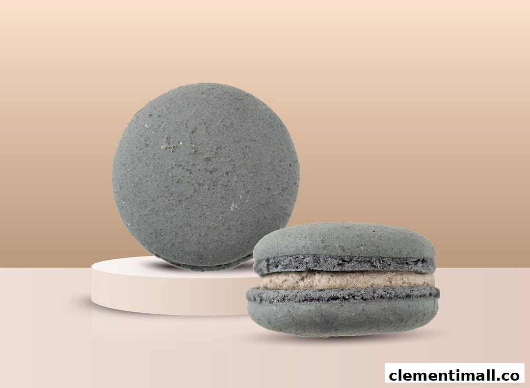 Two grey textured items, one spherical and one macaron-shaped, on a light background.
