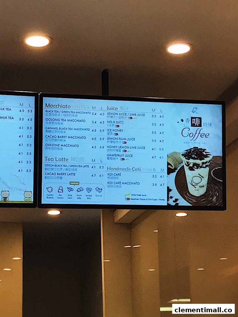 A digital menu board displaying various bubble tea, juice, and coffee options with prices.