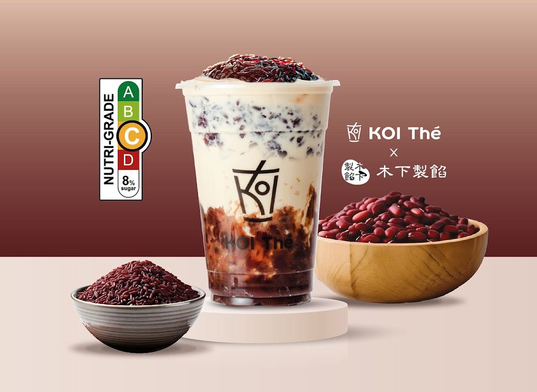 A promotional image featuring a KOI Thé red bean drink with ingredients and a Nutri-Grade label.