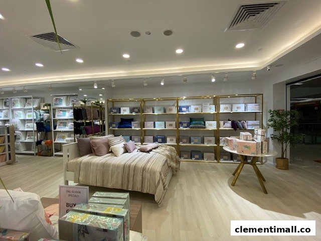 Interior view of KOMME, showcasing stylish bedding, pillows, and home essentials on display.