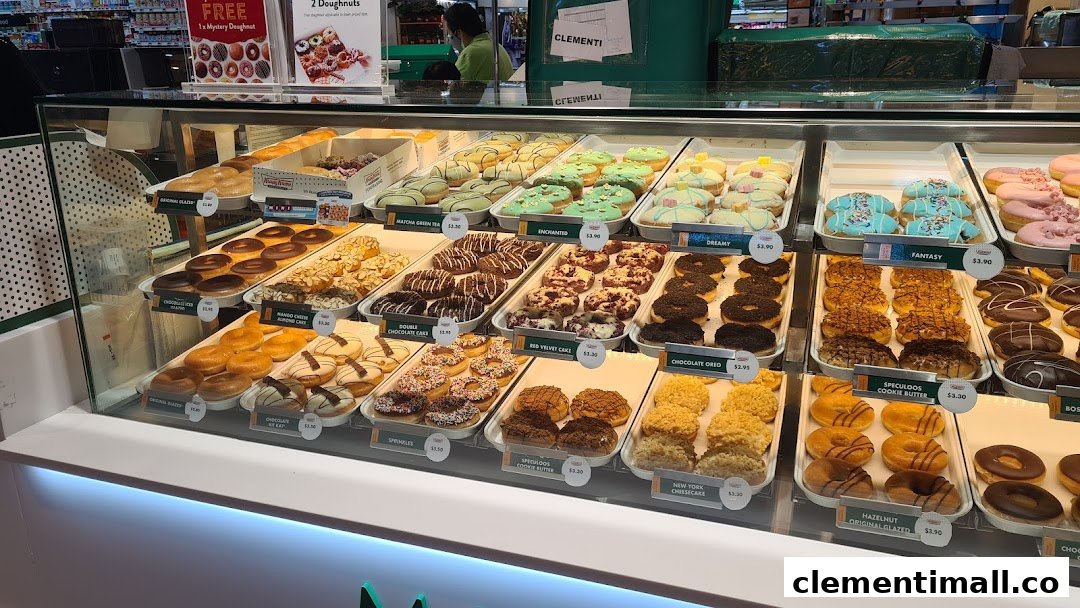 A vibrant display case showcasing a wide variety of Krispy Kreme doughnuts.