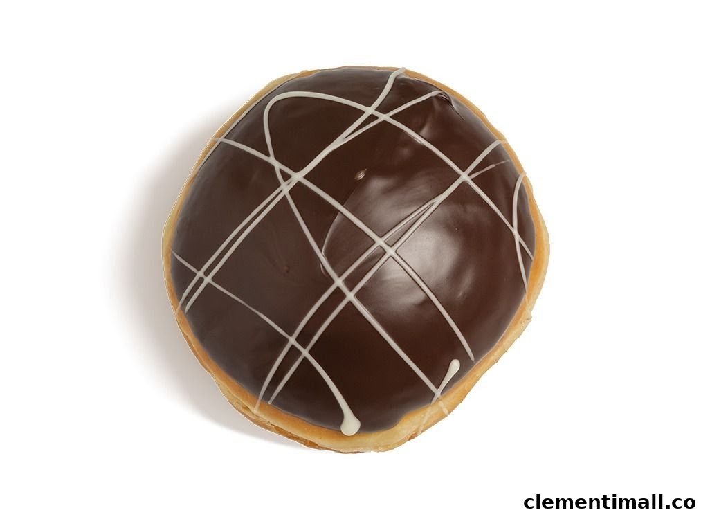 A chocolate-glazed donut with white icing drizzle, presented on a clean white background.