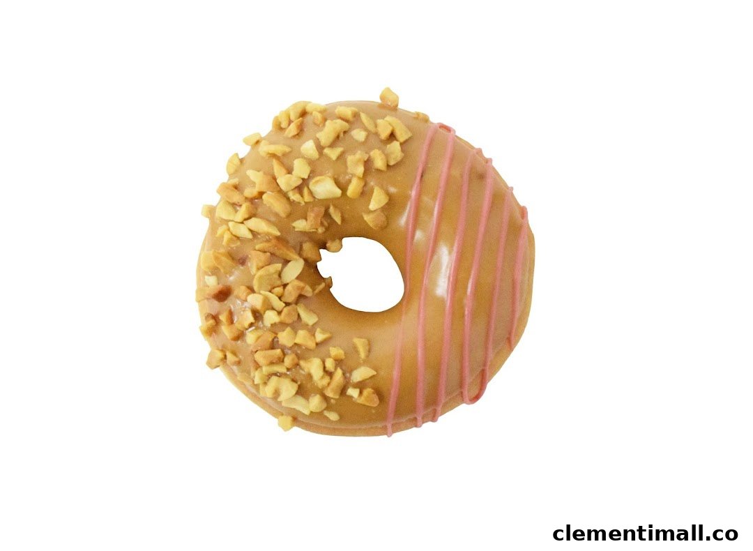 A delicious Krispy Kreme donut with peanut topping and pink icing drizzle on a white background.