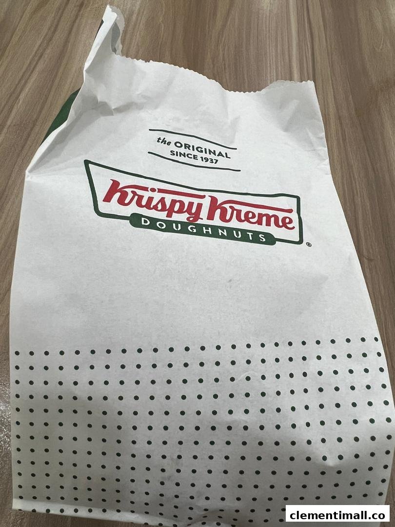 A white Krispy Kreme paper bag featuring the brand logo and 'the ORIGINAL SINCE 1937' text.