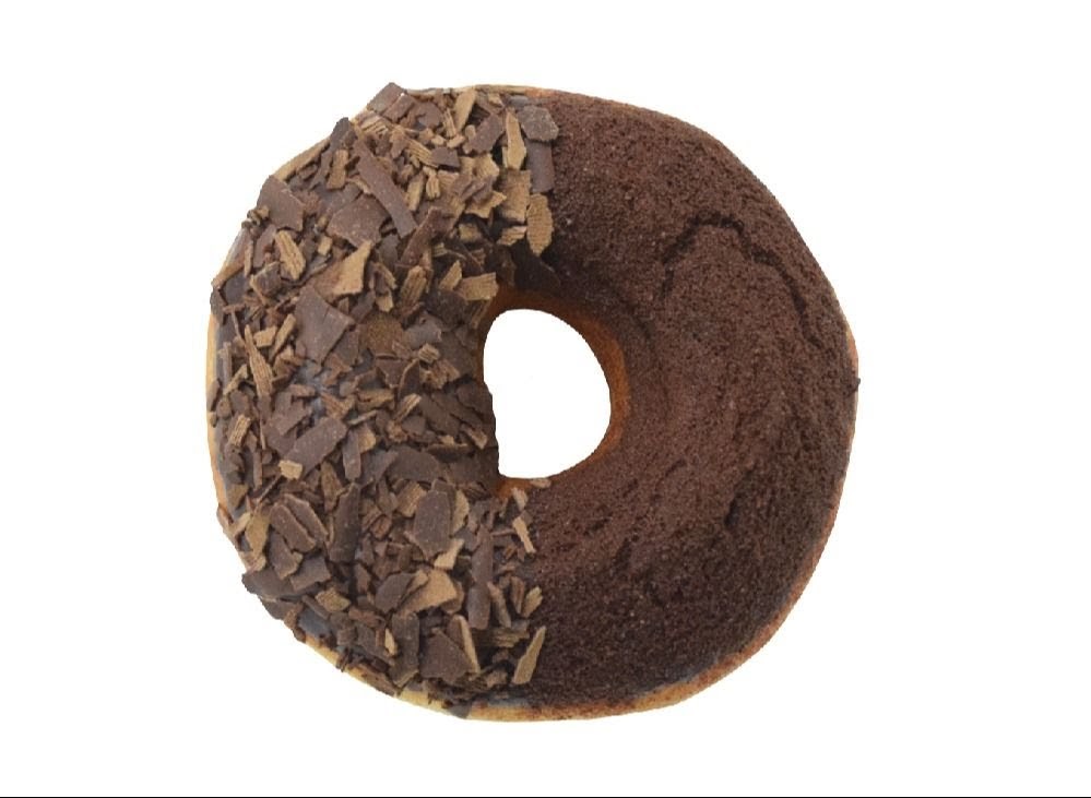 A chocolate donut with half chocolate shavings and half chocolate powder topping on a white background.
