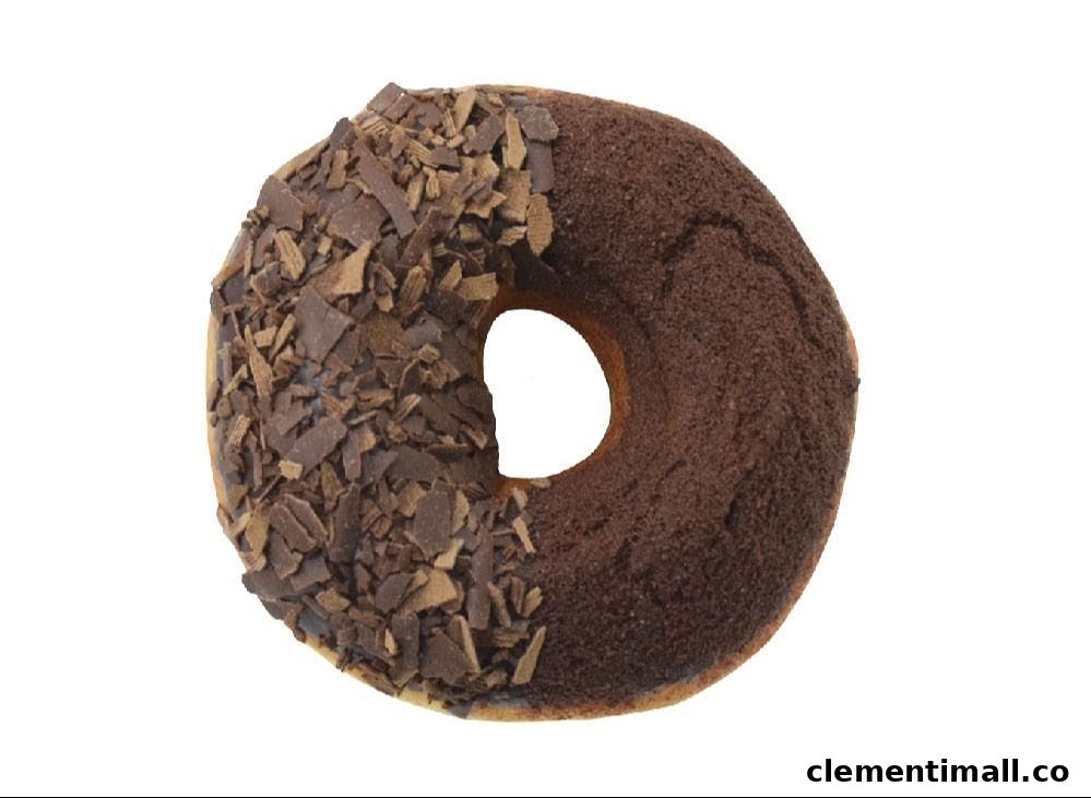 A chocolate donut with half chocolate shavings and half chocolate powder topping on a white background.