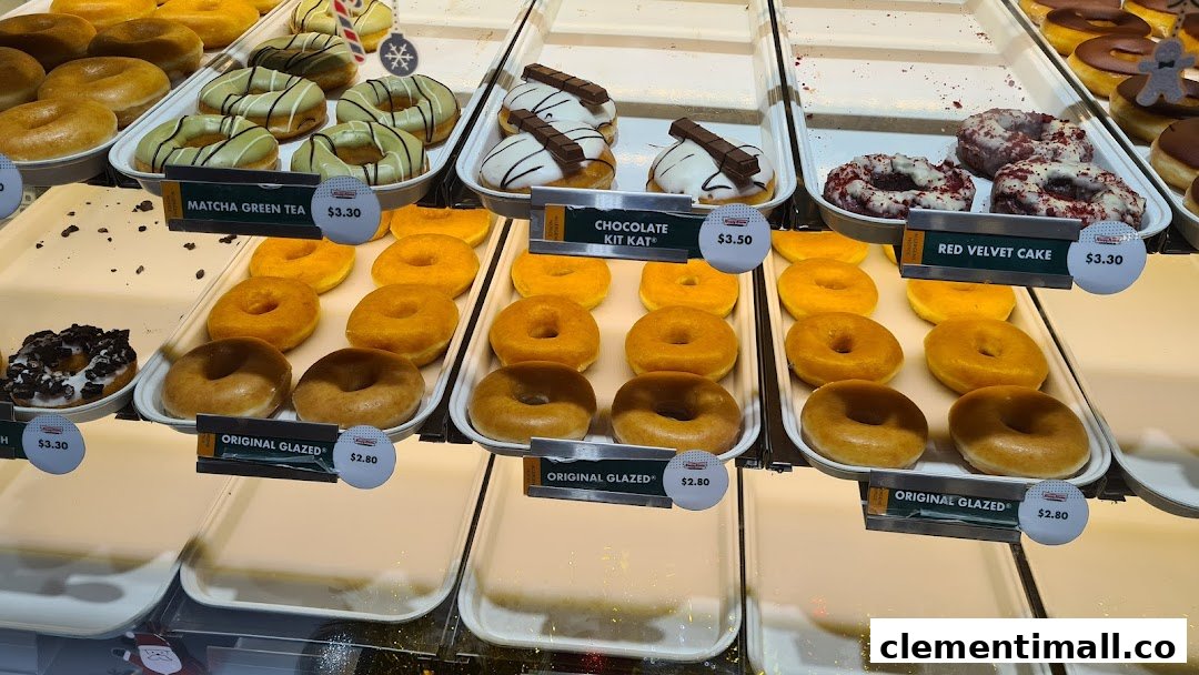 A vibrant display of various Krispy Kreme donuts, showcasing different flavors and prices.