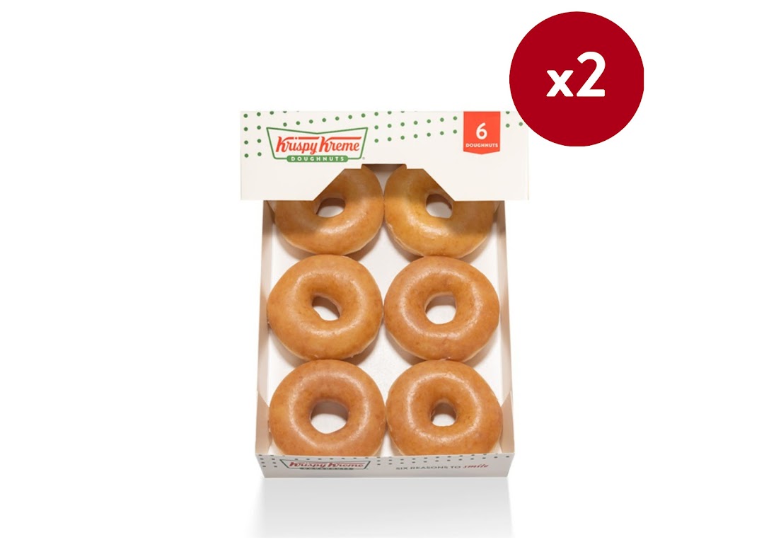 A box of six Krispy Kreme Original Glazed Doughnuts, ready to enjoy.