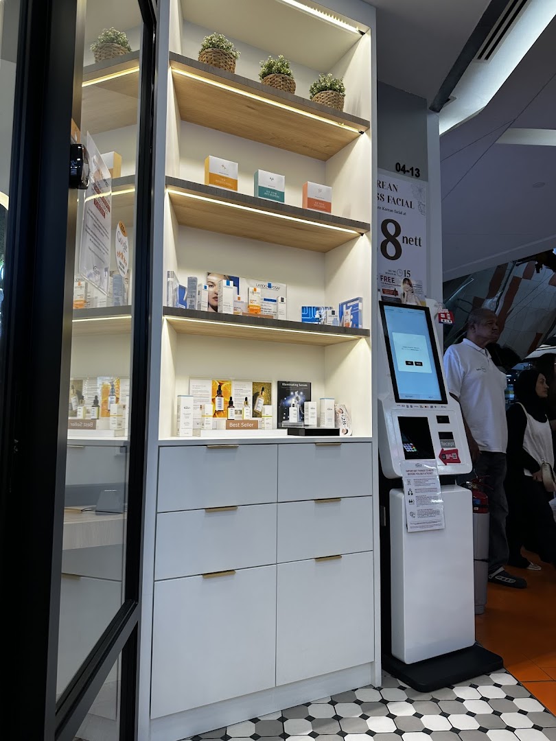 An illuminated display shelf showcasing skincare products and a self-service kiosk at Kskin Korean Express Facial.