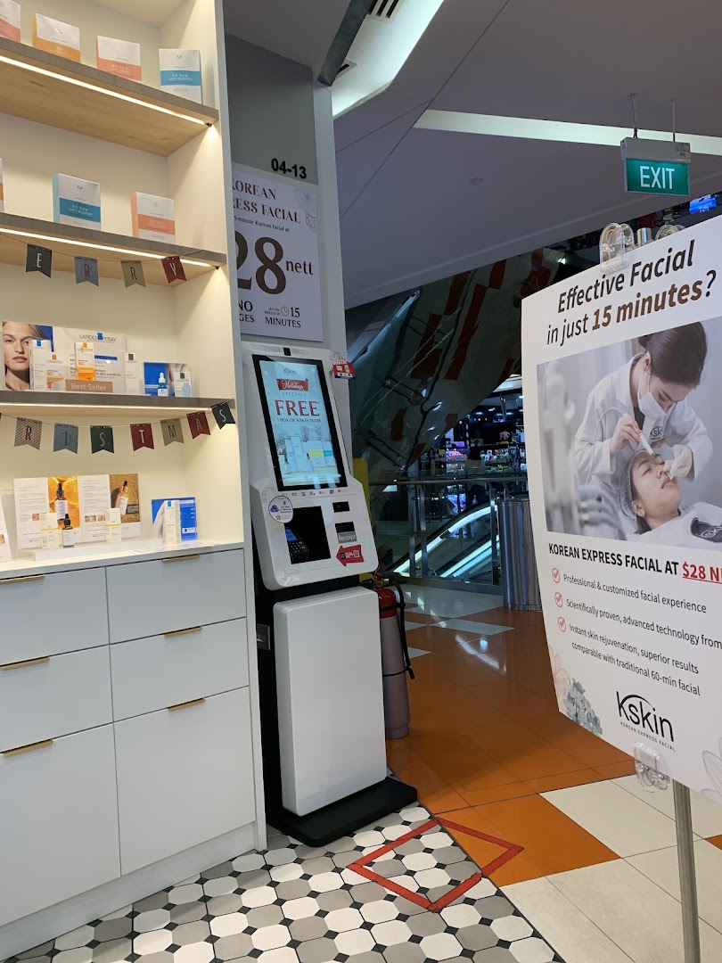 Interior view of Kskin Korean Express Facial shop, showcasing products, a self-service kiosk, and promotional signage.