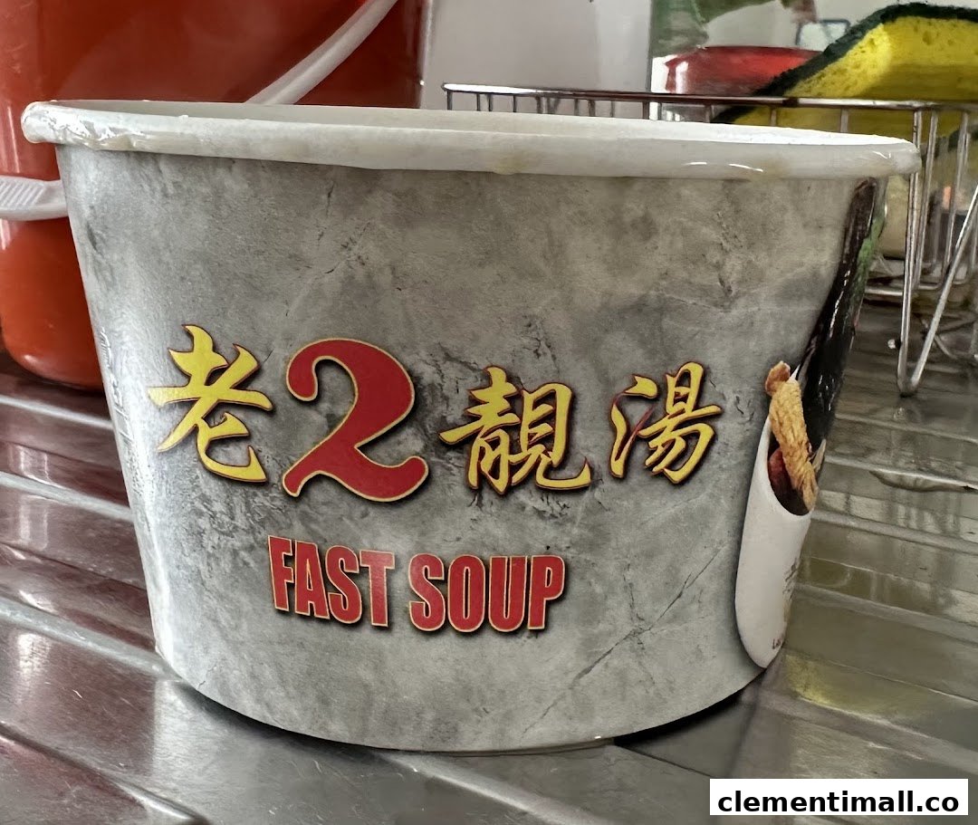 A grey takeaway container featuring the shop's name '老2靓汤' (Lao Er Liang Tang) and 'FAST SOUP'.