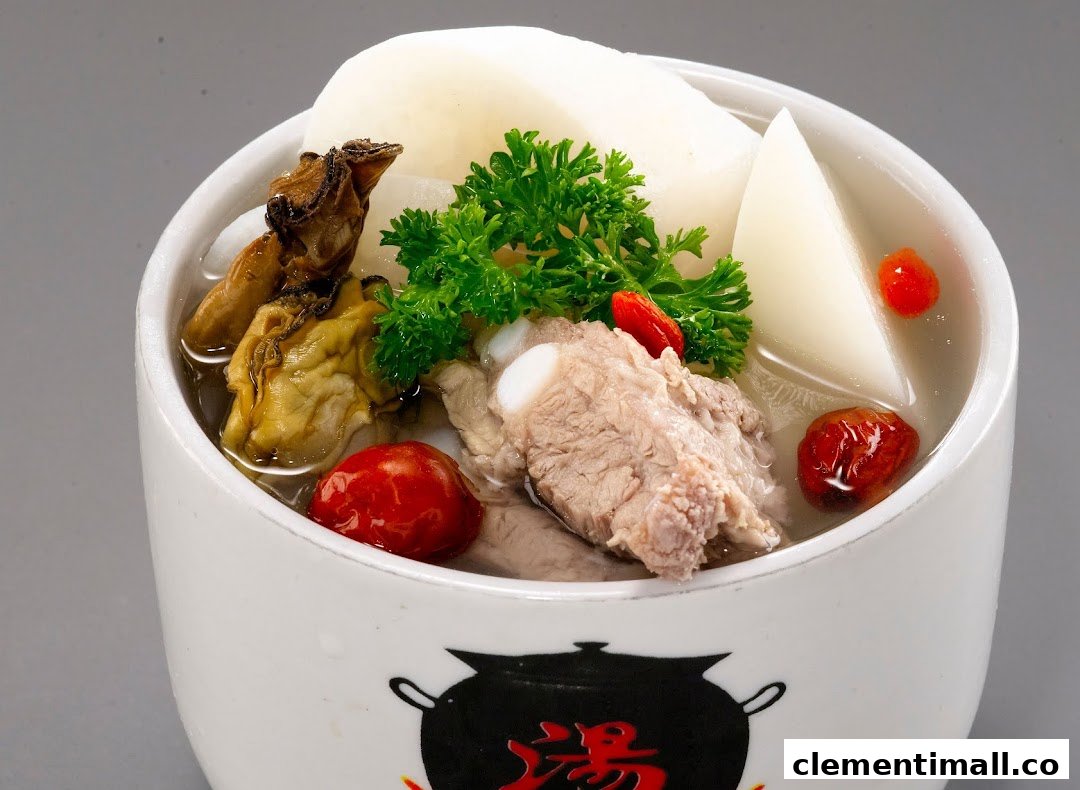 A close-up of a traditional Chinese herbal soup with pork ribs, dried oysters, radish, and goji berries.