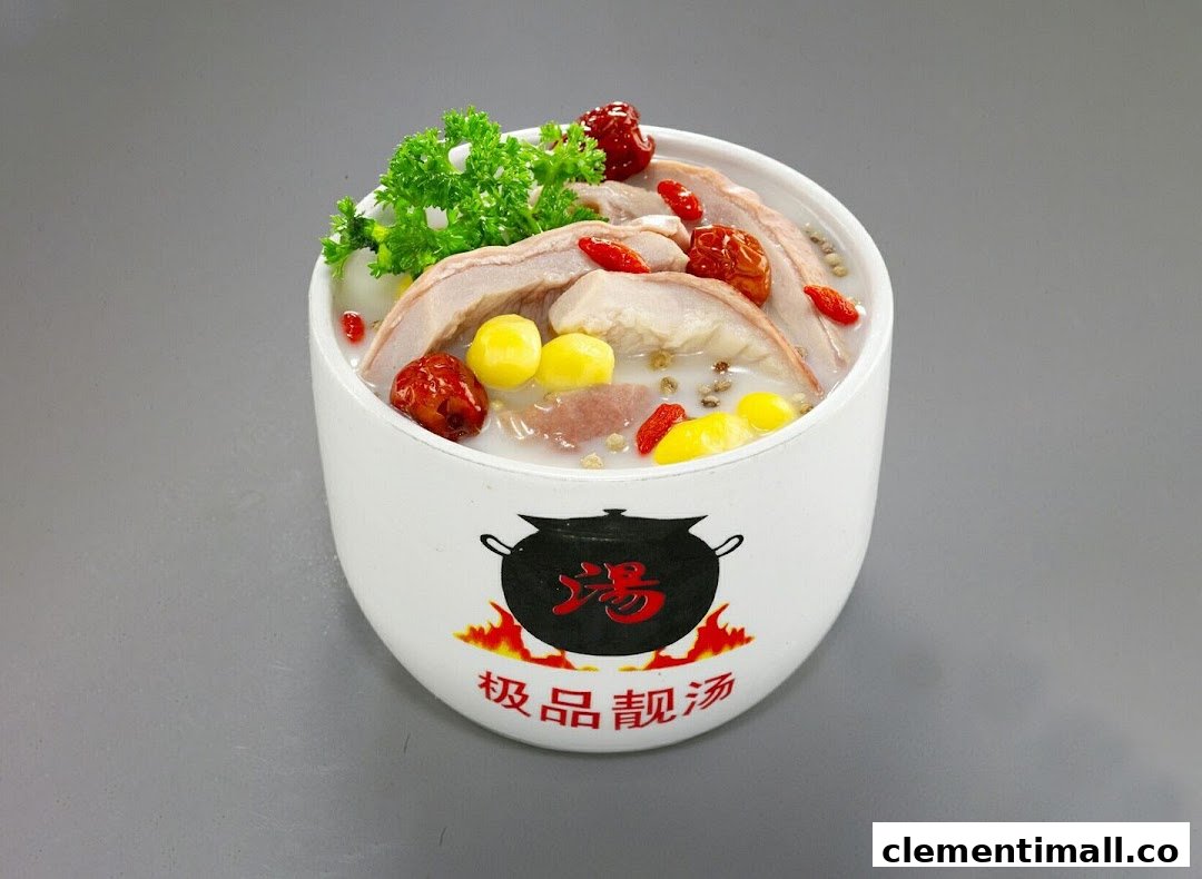 A white bowl filled with traditional Chinese herbal soup, garnished with herbs, red dates, and ginkgo nuts.