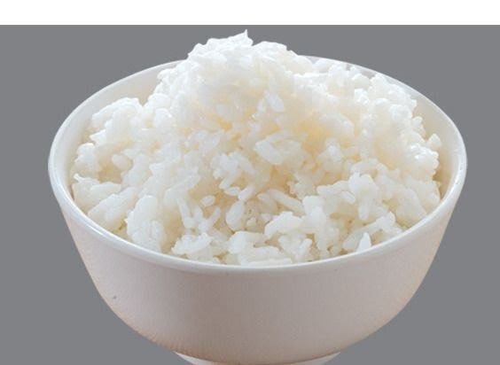 A white bowl filled with fluffy, perfectly cooked white rice.