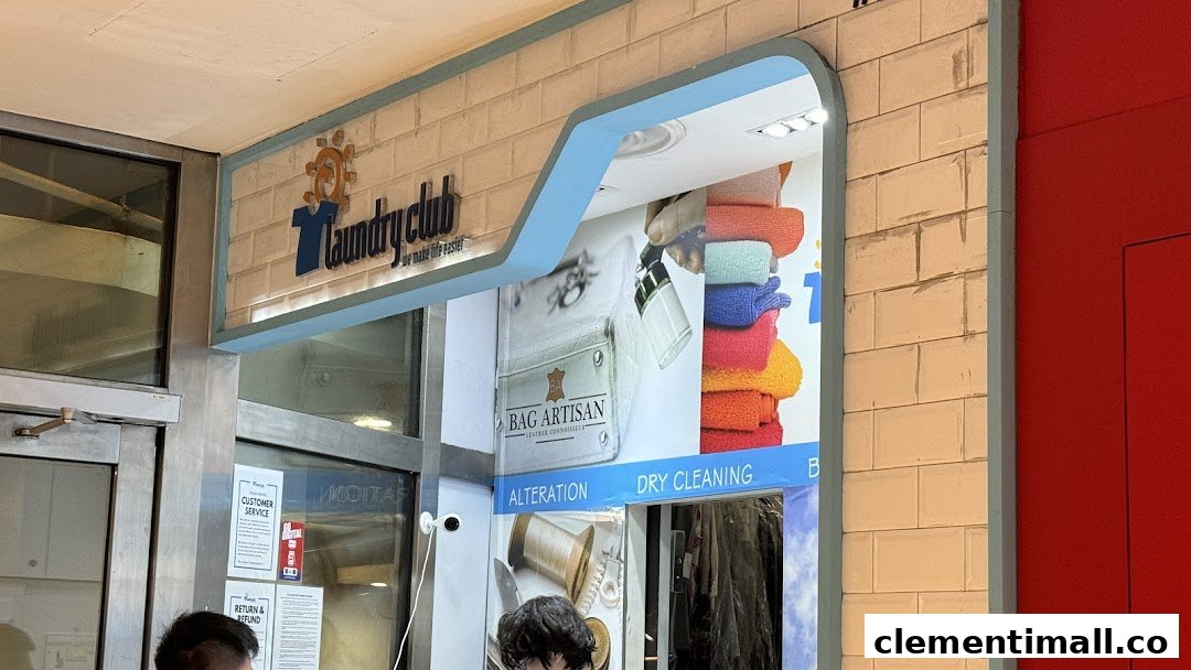 The exterior of Laundry Club, a modern laundry and dry cleaning service with a bright facade.