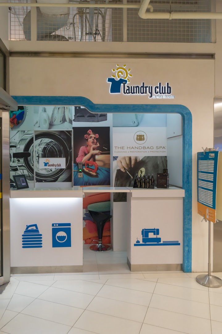 The entrance of Laundry Club, a service shop offering laundry, handbag spa, and tailoring.
