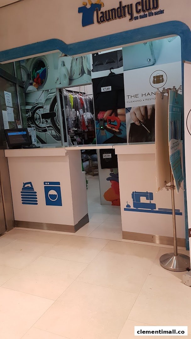 The entrance of Laundry Club, featuring laundry and cleaning service visuals and branding.