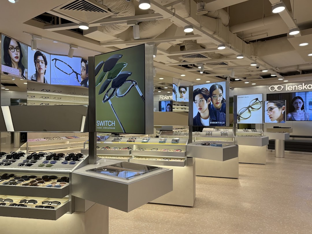 Interior view of Lenskart showcasing a wide range of eyewear displays and digital marketing screens.