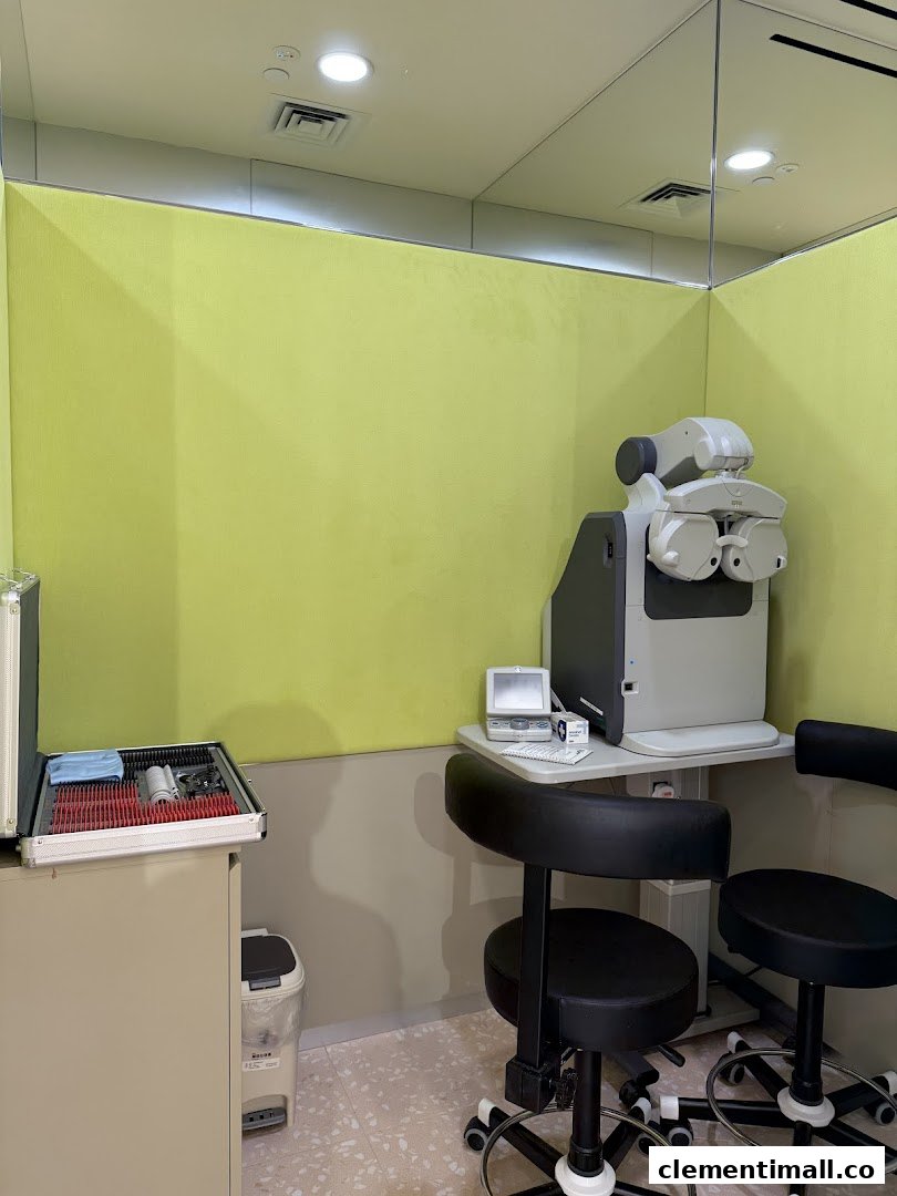 An eye examination room at Lenskart, featuring advanced optical equipment and seating for vision testing.