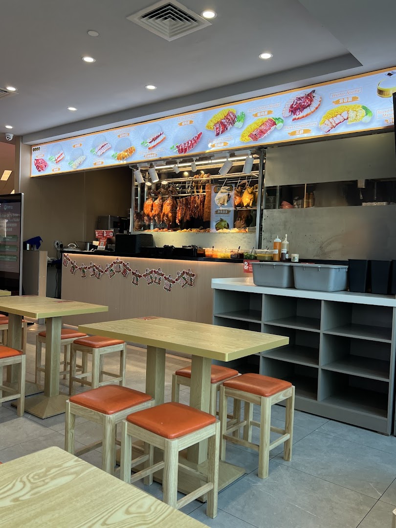 Interior view of M.Y Duck, showcasing roasted meats display, service counter, and dining area.