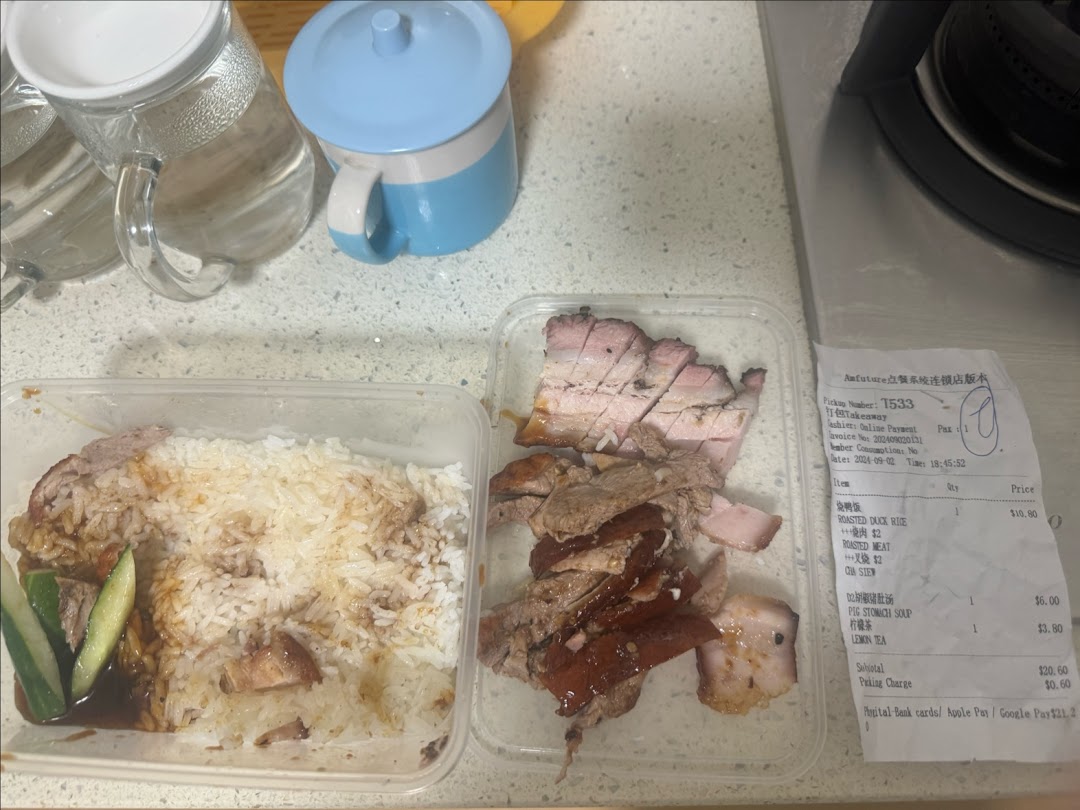 Takeaway containers with roasted duck and meat, alongside a detailed receipt from M.Y Duck.