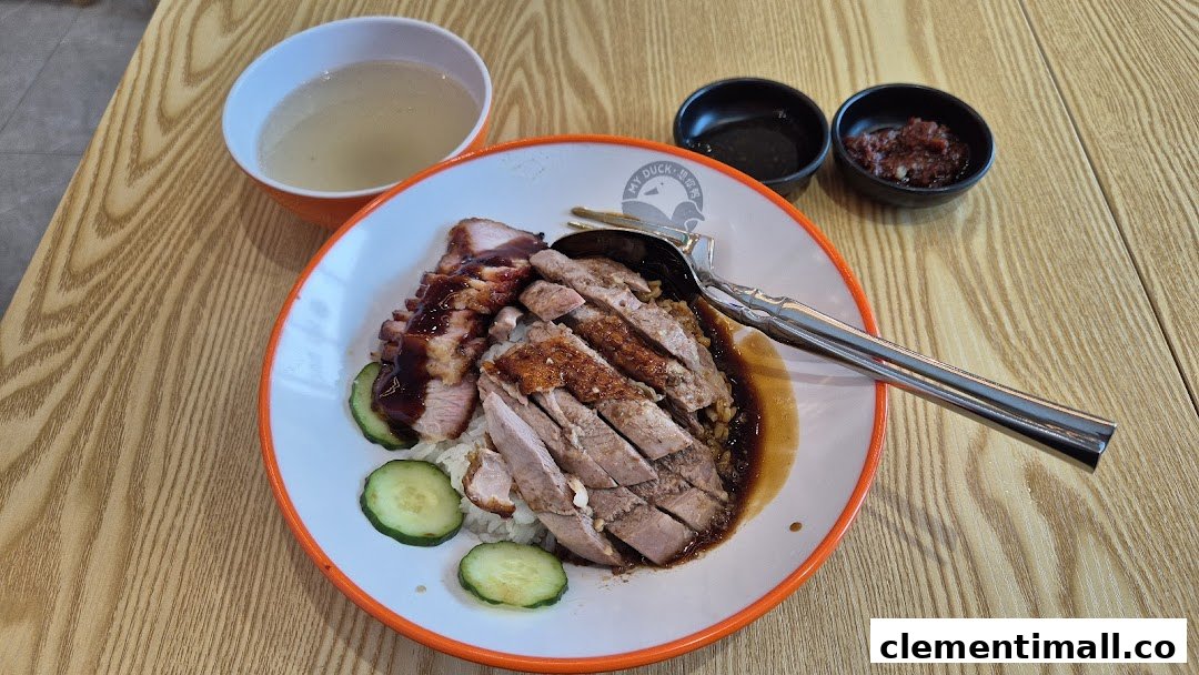 A delicious plate of roasted duck and char siu with rice, soup, and condiments from M.Y Duck.