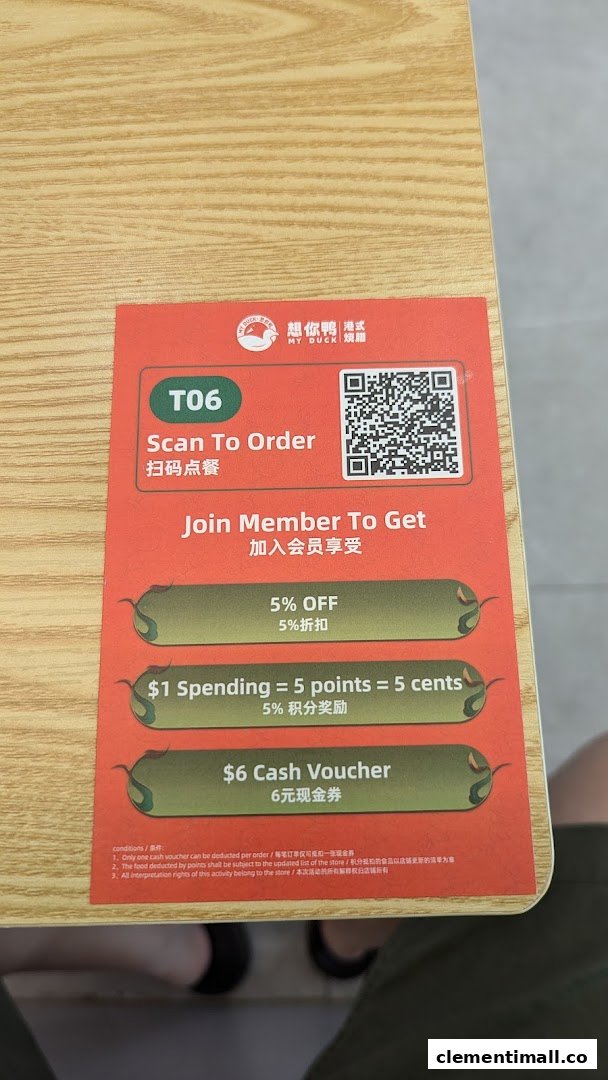 A table card from M.Y Duck displaying a QR code for ordering and member benefits.